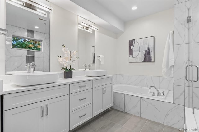 2745 Java Ct, Denver, CO 80211 - full bath featuring a garden tub, double vanity, and a marble finish shower