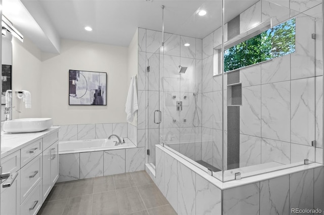 2745 Java Ct, Denver, CO 80211 - full bath with vanity, a bath, a marble finish shower, recessed lighting, and tile patterned floors