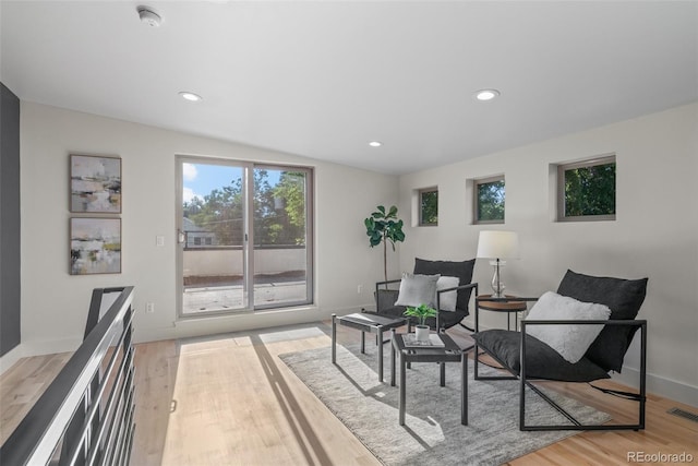 2745 Java Ct, Denver, CO 80211 - sitting room with light wood finished floors, recessed lighting, and lofted ceiling