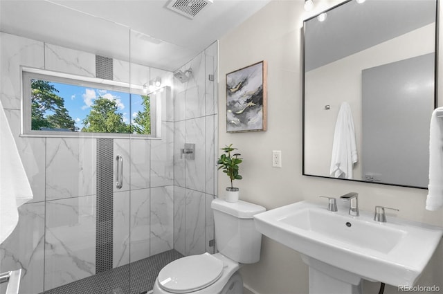 2745 Java Ct, Denver, CO 80211 - bathroom featuring toilet and a marble finish shower