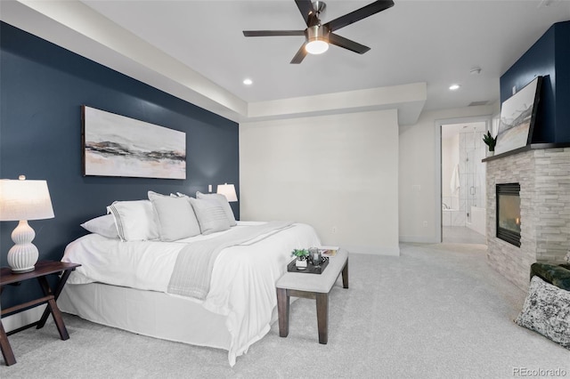 2745 Java Ct, Denver, CO 80211 - carpeted bedroom featuring a glass covered fireplace, recessed lighting, ceiling fan, and ensuite bath