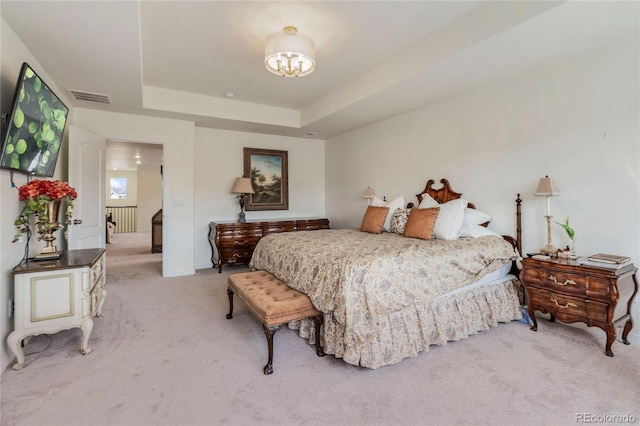 14938 Vienna Cir, Parker, CO 80134 - bedroom with light colored carpet, a raised ceiling, and a chandelier