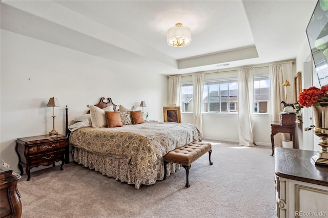 14938 Vienna Cir, Parker, CO 80134 - bedroom with light colored carpet, multiple windows, a tray ceiling, and baseboards