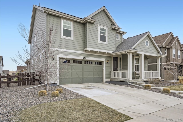 view of front of home featuring fence, covered porch, a garage, and concrete driveway
