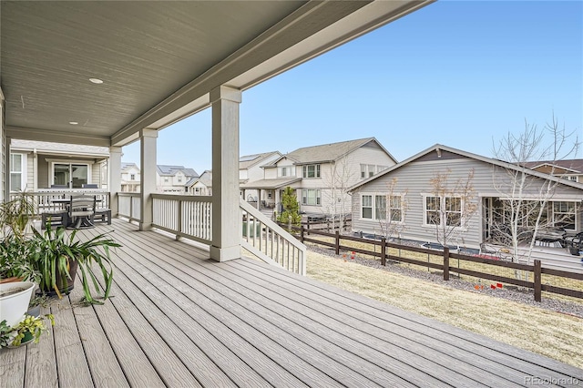 wooden terrace with fence and a residential view