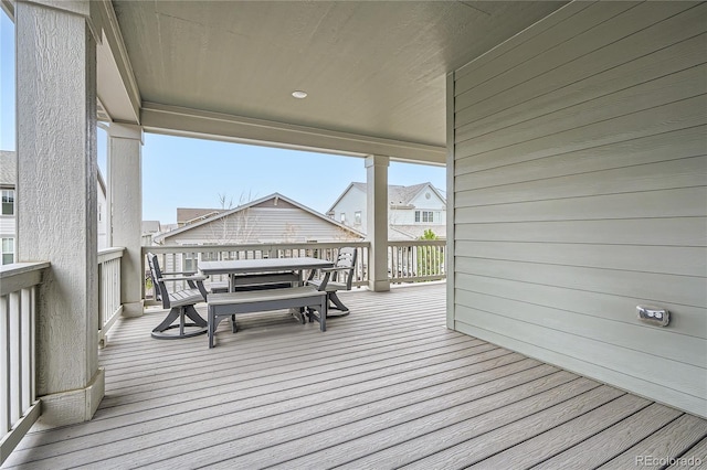wooden deck featuring outdoor dining space