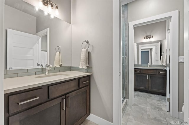 bathroom with vanity and a shower with shower door