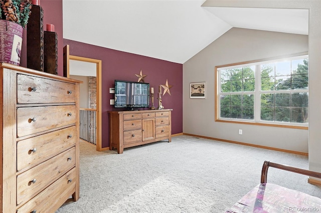 5683 Fig Way, Arvada, CO 80002 - bedroom featuring lofted ceiling, light carpet, and baseboards