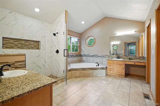 5683 Fig Way, Arvada, CO 80002 - full bath featuring vanity, a bath, a marble finish shower, vaulted ceiling, and recessed lighting
