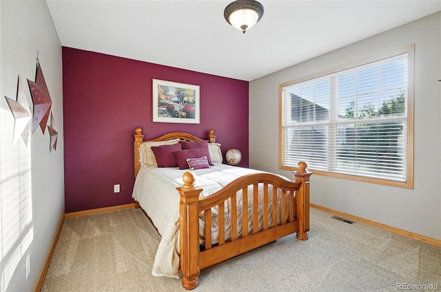 5683 Fig Way, Arvada, CO 80002 - carpeted bedroom featuring baseboards and an accent wall