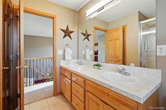 5683 Fig Way, Arvada, CO 80002 - full bathroom with double vanity, tile patterned floors, and an enclosed shower