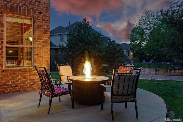5683 Fig Way, Arvada, CO 80002 - patio terrace at dusk with a fire pit and a patio area
