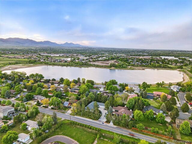 5683 Fig Way, Arvada, CO 80002 - aerial perspective of suburban area featuring a water and mountain view
