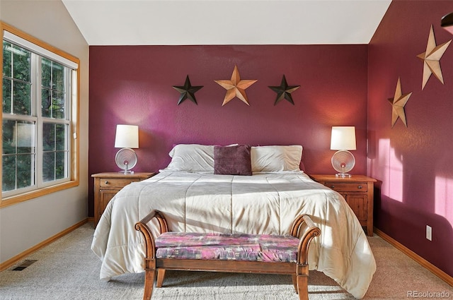 5683 Fig Way, Arvada, CO 80002 - bedroom featuring light carpet, lofted ceiling, and an accent wall