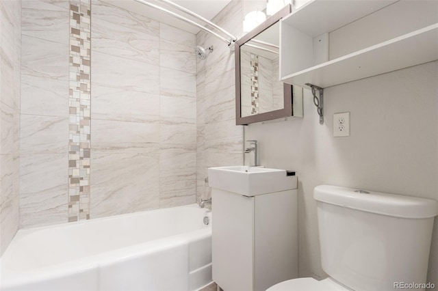 bathroom with vanity, toilet, and bathing tub / shower combination