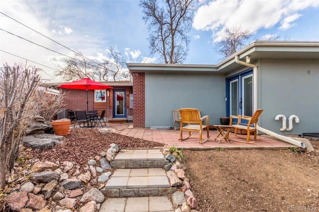 back of property featuring a patio