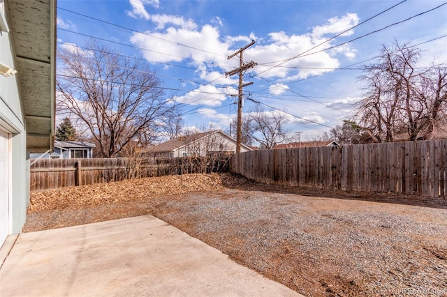 view of yard featuring a patio and a fenced backyard