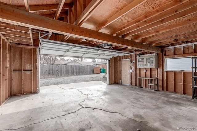 misc room with concrete floors and a garage