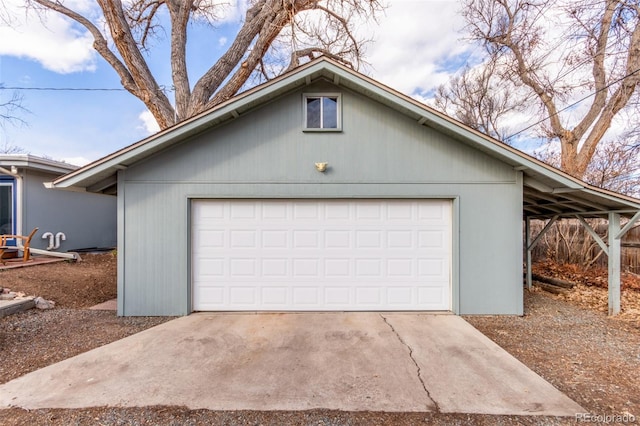 garage with concrete driveway
