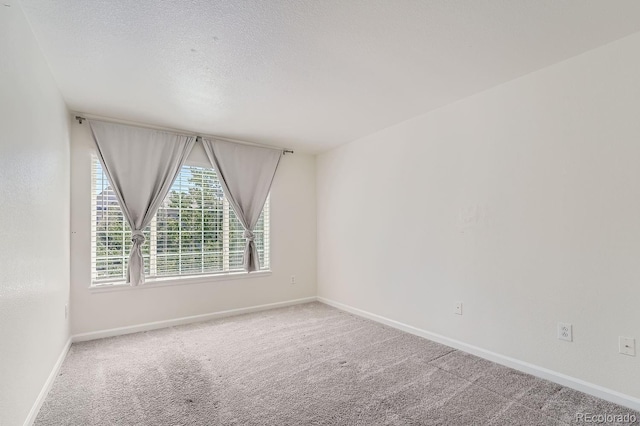 unfurnished room with carpet floors