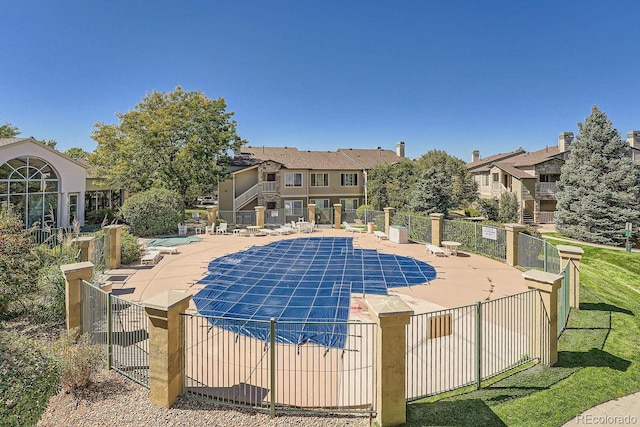 view of swimming pool with a patio