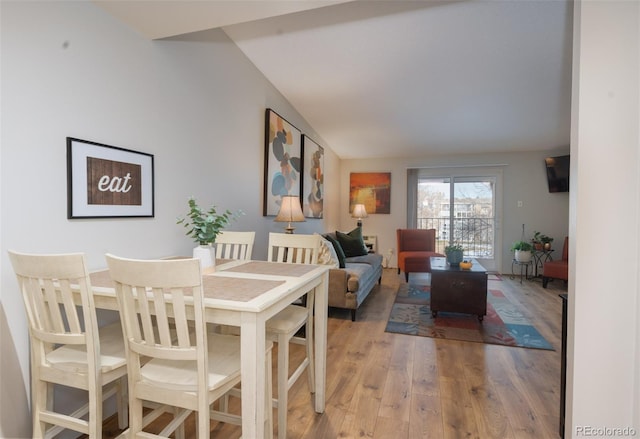 dining space featuring light wood-style flooring