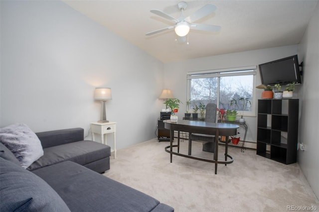 office area with lofted ceiling, ceiling fan, and light colored carpet