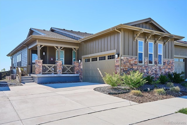 2012 Sagerock Dr, Castle Pines, CO 80108 - craftsman inspired home featuring board and batten siding, covered porch, a garage, concrete driveway, and stone siding