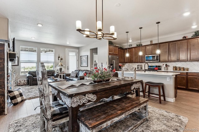 2012 Sagerock Dr, Castle Pines, CO 80108 - dining area featuring a chandelier and recessed lighting