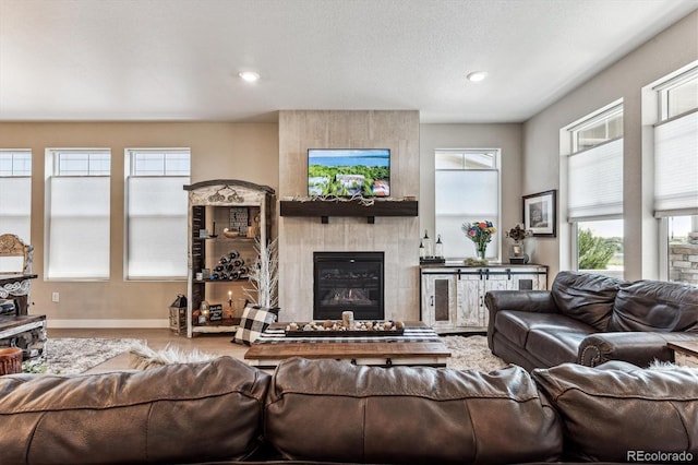 2012 Sagerock Dr, Castle Pines, CO 80108 - living room featuring a large fireplace and recessed lighting