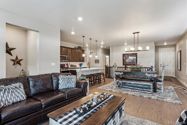 2012 Sagerock Dr, Castle Pines, CO 80108 - living room featuring wood finished floors and recessed lighting
