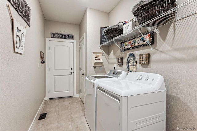 2012 Sagerock Dr, Castle Pines, CO 80108 - washroom with washer and dryer and light wood-style flooring
