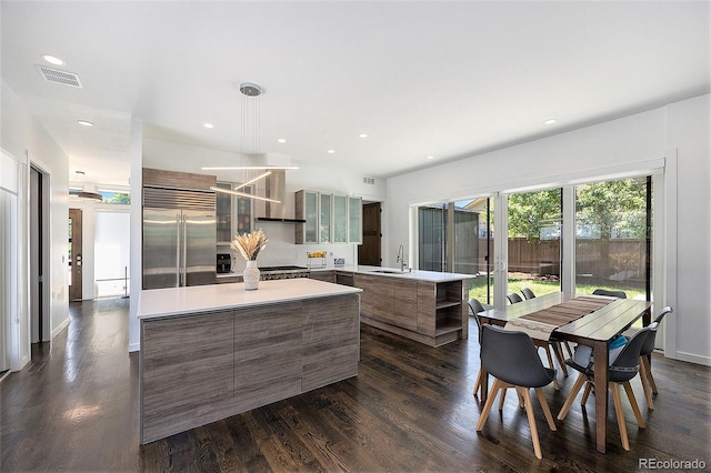3057 S University Cir, Englewood, CO 80113 - kitchen featuring built in fridge, modern cabinets, a center island, dark wood finished floors, and recessed lighting