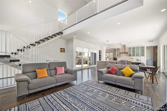 3057 S University Cir, Englewood, CO 80113 - living area featuring dark wood finished floors, stairway, recessed lighting, and a towering ceiling