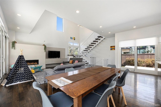 3057 S University Cir, Englewood, CO 80113 - dining space with wood finished floors, stairway, recessed lighting, and a fireplace