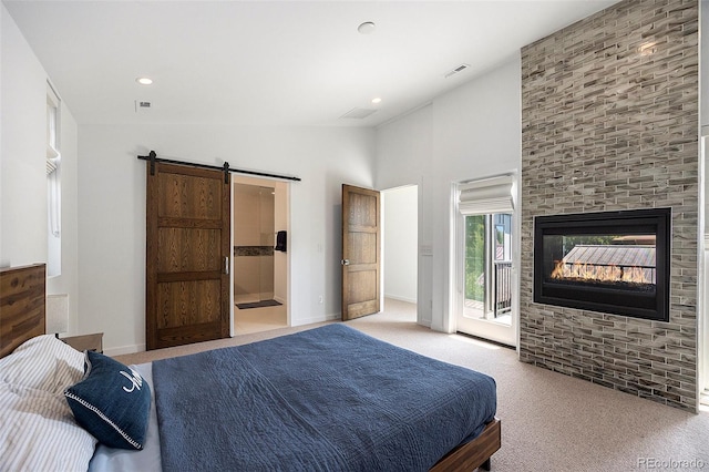 3057 S University Cir, Englewood, CO 80113 - bedroom with access to outside, vaulted ceiling, carpet flooring, a barn door, and recessed lighting