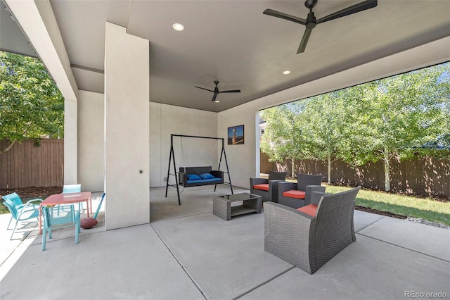 3057 S University Cir, Englewood, CO 80113 - fenced backyard with ceiling fan, outdoor lounge area, a patio area, and outdoor dining area