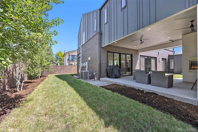 3057 S University Cir, Englewood, CO 80113 - fenced backyard featuring a ceiling fan and a patio area