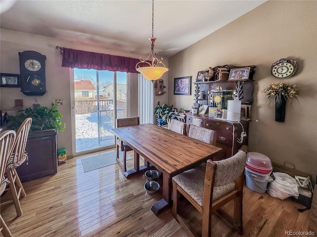 dining space with light wood-type flooring