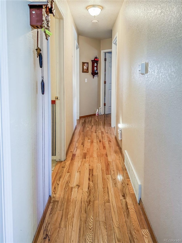 hall featuring light hardwood / wood-style floors