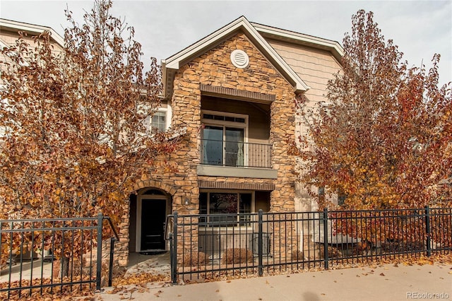 view of front of property with a balcony