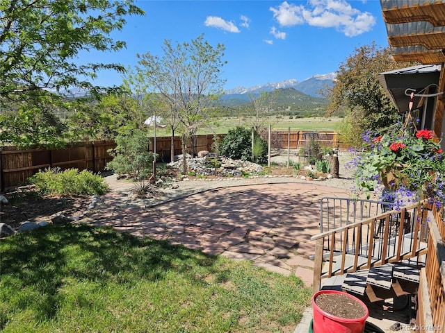 11679 US Highway 50, Howard, CO 81233 - fenced backyard with a mountain view and a patio