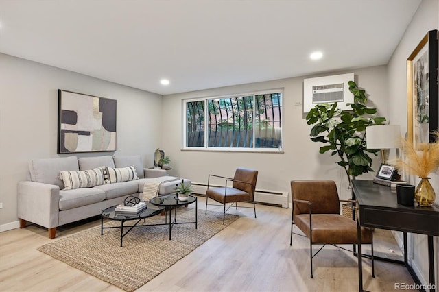 living room with light wood-type flooring, a wall mounted AC, and baseboard heating