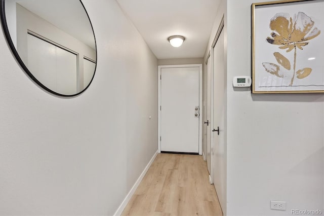 doorway to outside with light hardwood / wood-style flooring