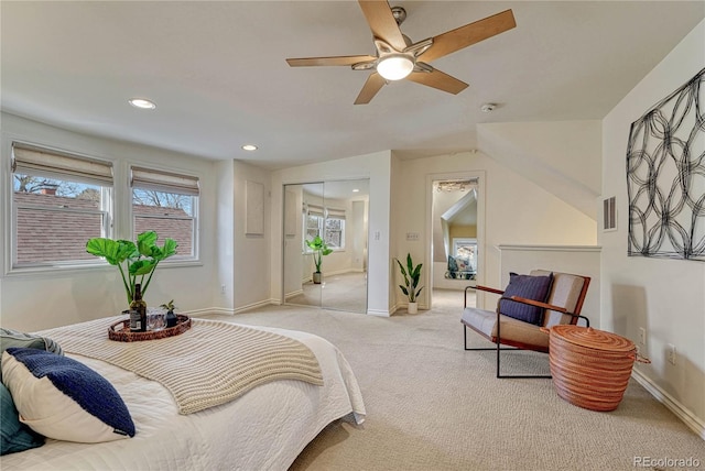 bedroom featuring baseboards, light carpet, recessed lighting, and visible vents