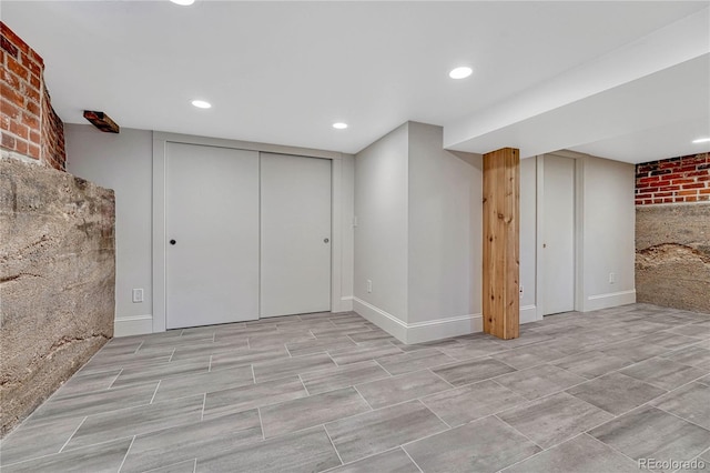 finished below grade area with recessed lighting and baseboards