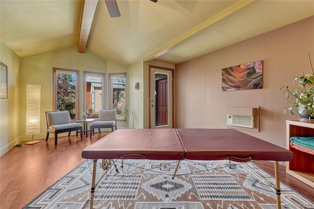 office featuring lofted ceiling with beams, a ceiling fan, baseboards, a wall unit AC, and wood finished floors