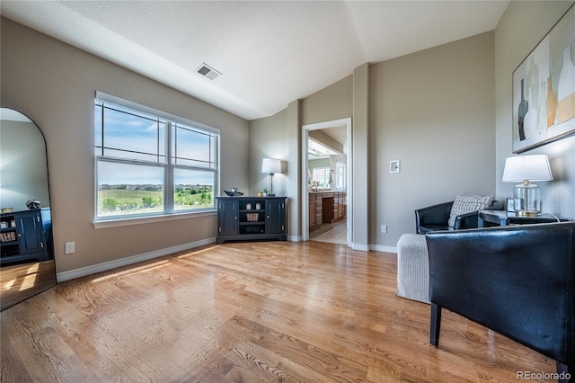 26741 E Arbor Dr, Aurora, CO 80016 - living room with vaulted ceiling, light wood-style flooring, healthy amount of natural light, and baseboards
