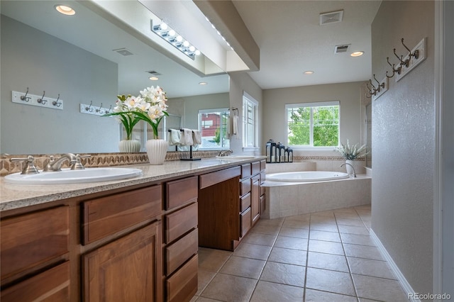26741 E Arbor Dr, Aurora, CO 80016 - bathroom featuring double vanity, a bath, tile patterned floors, and recessed lighting