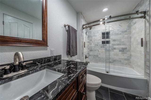 26741 E Arbor Dr, Aurora, CO 80016 - full bath with vanity, enclosed tub / shower combo, toilet, tile patterned flooring, and a textured wall